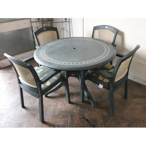 337 - A circular plastic garden table with four matching chairs by Hartman