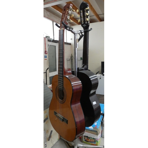 346 - A double guitar stand with a Kivara Classical Guitar, a Hohner guitar and two music stands