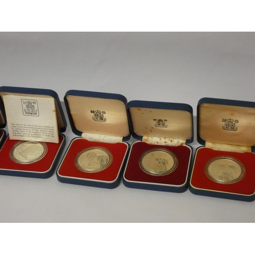 552 - Six cased silver Queen Elizabeth commemorative crowns