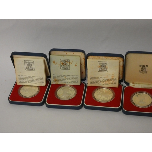 555 - Six cased silver Queen Elizabeth commemorative crowns