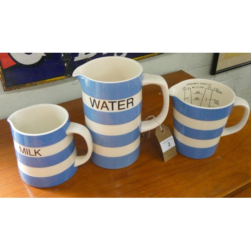 2 - Three Cornishware blue and white jugs - 'Water',  'Milk' and a measuring jug, back stamped 