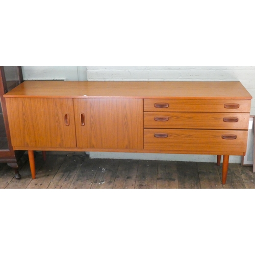 40 - A long low modern teak sideboard cupboards and three drawers, 70