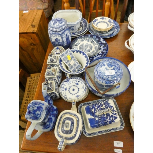 55 - Assorted blue and white plates, store jars, biscuit barrels, cheese dish and other blue and white