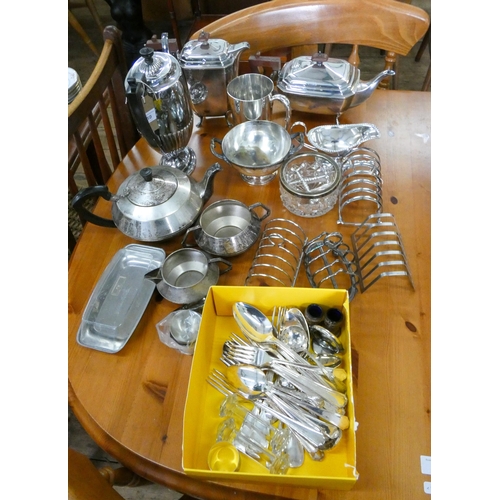 59 - A quantity of assorted silver plated items, toast racks, cutlery etc