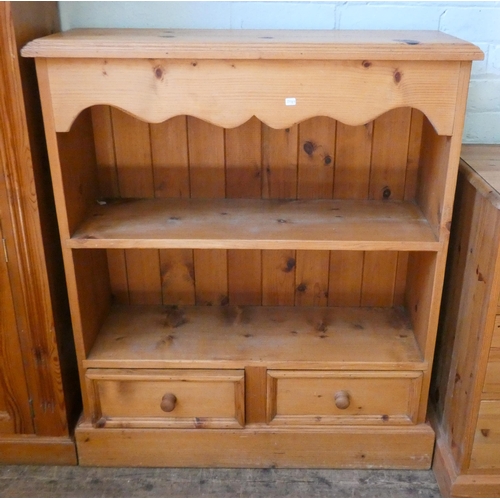 90 - A low modern pine open bookcase with two drawers under, 34