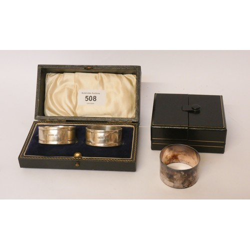 508 - A pair of cased hallmarked silver napkin rings, hallmarks for Sheffield 1929 together with another c... 