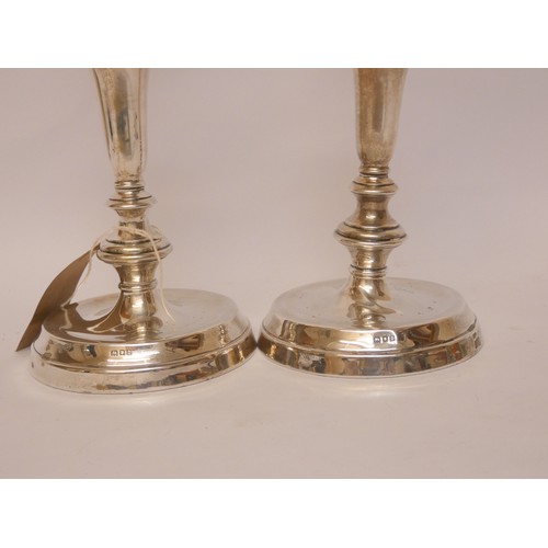 510 - A pair of  hallmarked silver candlesticks, London 1919