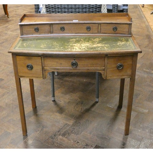 164 - An Edwardian mahogany bow front writing table, fitted three drawers with small tray top back, fitted... 