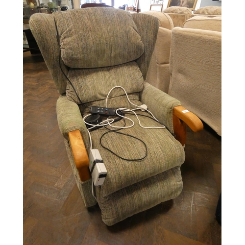 121 - An electric rise and recline easy chair in mottled green material