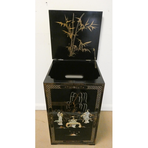 140 - A Chinese black lacquered and floral single door and lift top cabinet with applied mother of pearl p... 