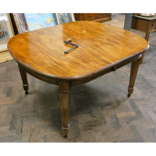 161 - A Victorian oval mahogany extending dining table with two centre leaves, standing on square taper le... 