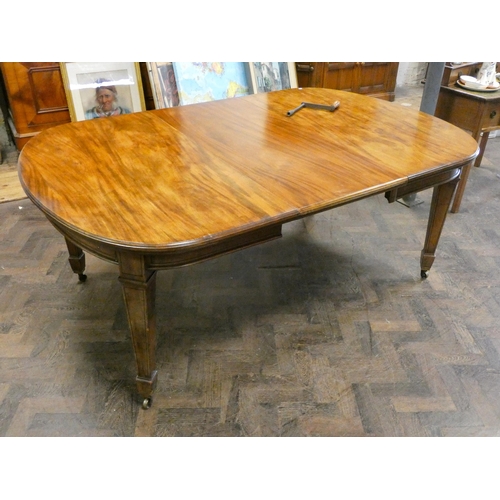 161 - A Victorian oval mahogany extending dining table with two centre leaves, standing on square taper le... 