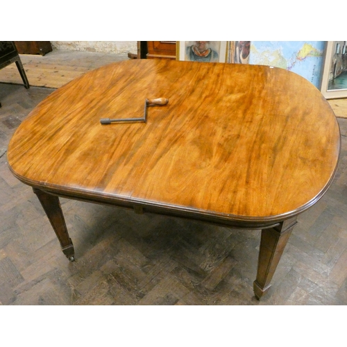 161 - A Victorian oval mahogany extending dining table with two centre leaves, standing on square taper le... 