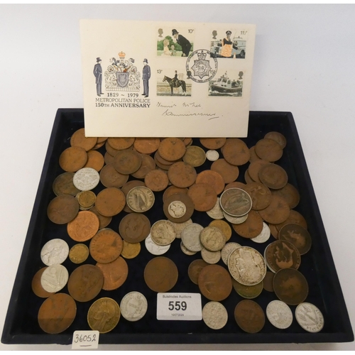 559 - A small accumulation of English and foreign coins, a few in silver, together with a first day cover ... 