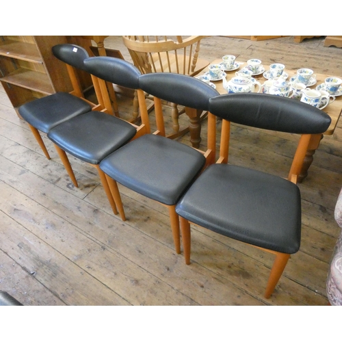 70 - A set of four retro Schreiber teak dining chairs with black vinyl  upholstered seats and back pads