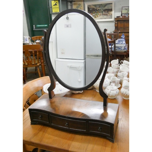 81 - A Georgian style mahogany oval toilet mirror, with three drawers in the base