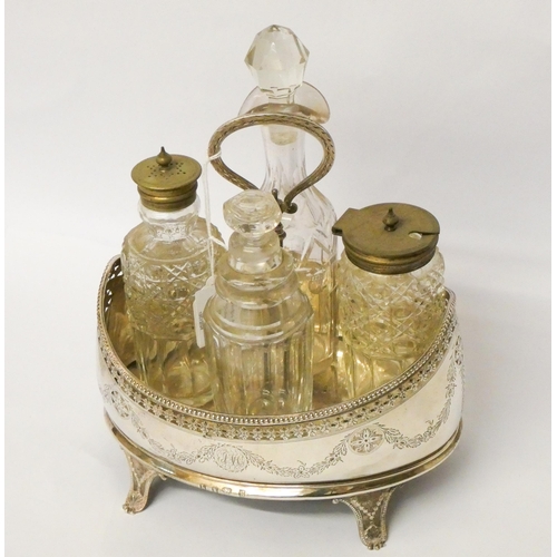 528 - Georgian silver boat shaped cruet stand with four associated glass bottles. Stand with wooden base l... 