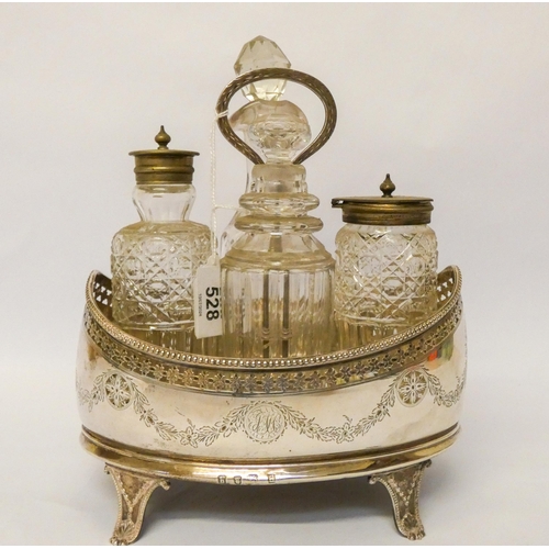 528 - Georgian silver boat shaped cruet stand with four associated glass bottles. Stand with wooden base l... 