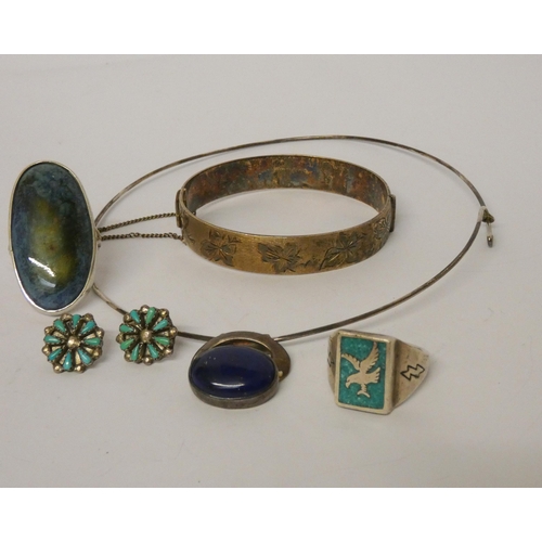 538 - A silver hinged bangle, dress rings, earrings and a pendant