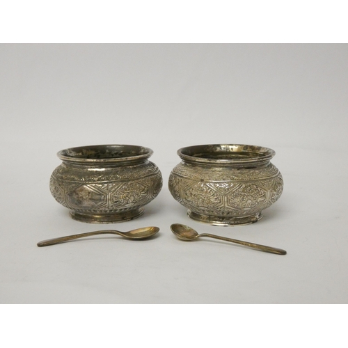 531 - A pair of Victorian circular silver salt cellars, hallmarked London 1873, all over engraved decorati... 