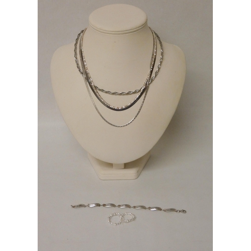 608 - A Hot Diamonds silver bracelet, pair of silver hoop earrings and four silver necklaces and chains.