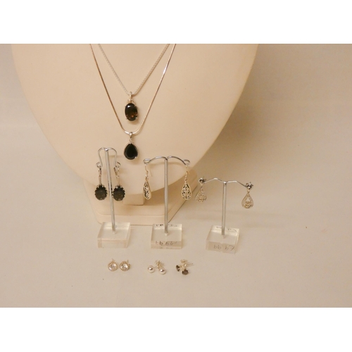 609 - Six pairs of silver earrings and two pendants on silver chains, set with smoky quartz.