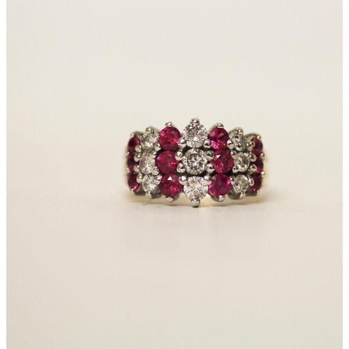 604 - A modern ruby and diamond set wide band dress ring, on hallmarked 18ct yellow gold band, ring size N... 