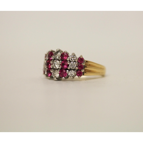 604 - A modern ruby and diamond set wide band dress ring, on hallmarked 18ct yellow gold band, ring size N... 