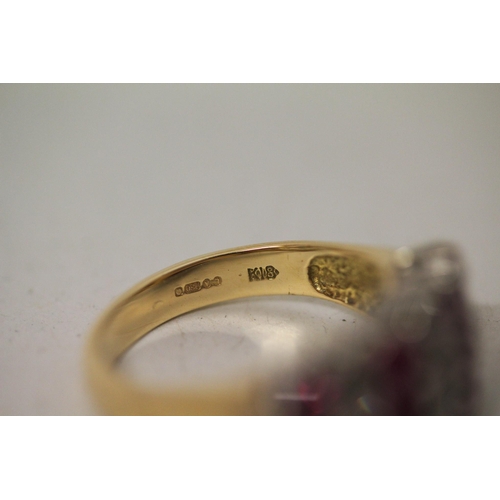 604 - A modern ruby and diamond set wide band dress ring, on hallmarked 18ct yellow gold band, ring size N... 