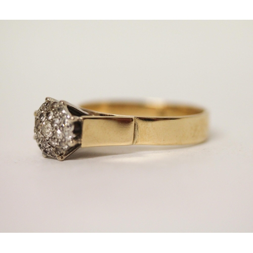 611 - A large diamond cluster ring, on yellow gold band marked '18ct'. Ring size U, gross weight 6.1g