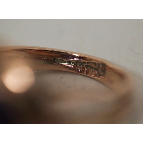 623 - A single stone ring, the circular colour change spinel within collet setting on a rose gold band, in... 