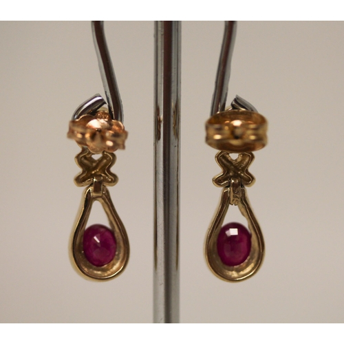 593 - A pair of modern 9ct yellow gold, ruby and diamond drop earrings. Hallmarked on posts. Gross weight ... 