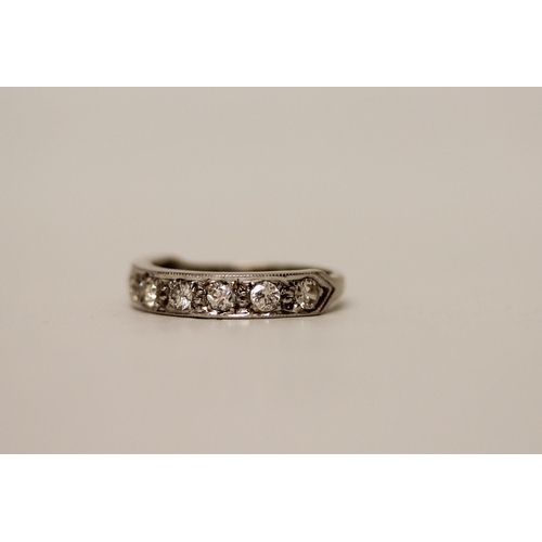 595 - A vintage 18ct white gold diamond half hoop eternity ring, size N, gross weight 4 .1 grams