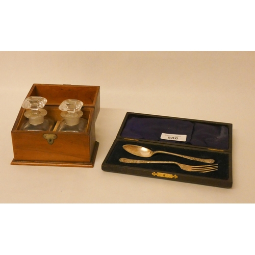 586 - A Victorian inkwell set in fitted wooden box and a silver plated christening set in case