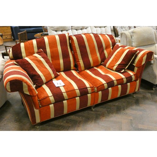 112A - A good red and gold striped Duresta settee with loose cushions and arm covers