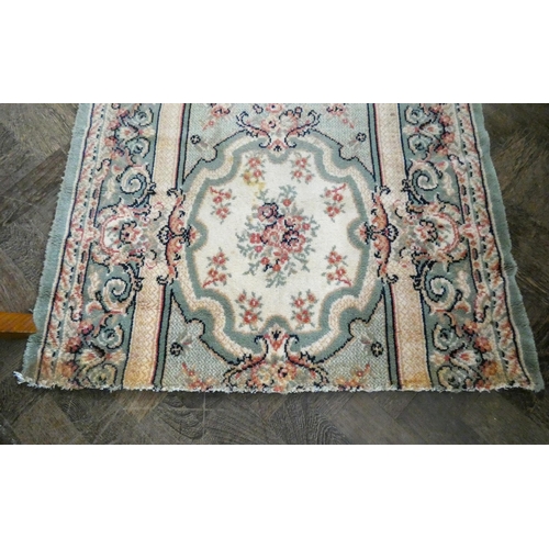 66 - Three assorted rugs and long carpet runner