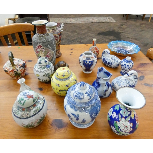 33 - A collection of Oriental ceramics to include, ginger jars and covers, charger wall plate, octagonal ... 