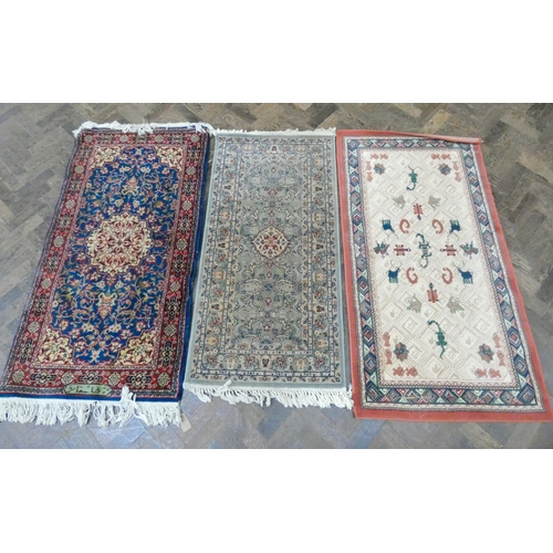 66 - Three assorted rugs and long carpet runner