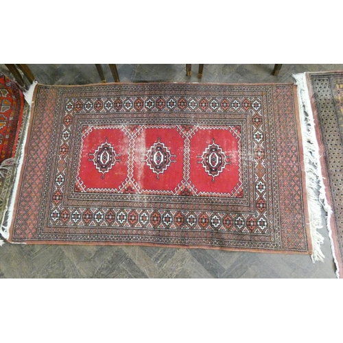 97 - Three various Bokhara and other rugs (worn) and three small Persian style prayer mats