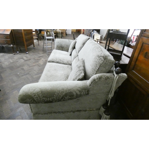 43 - A Duresta large three seater Knole style sofa with drop end upholstered in a moss green figured velv... 