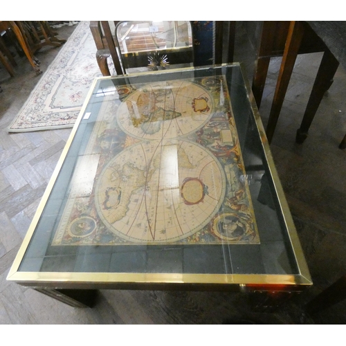 73 - A large brass bound map top coffee table