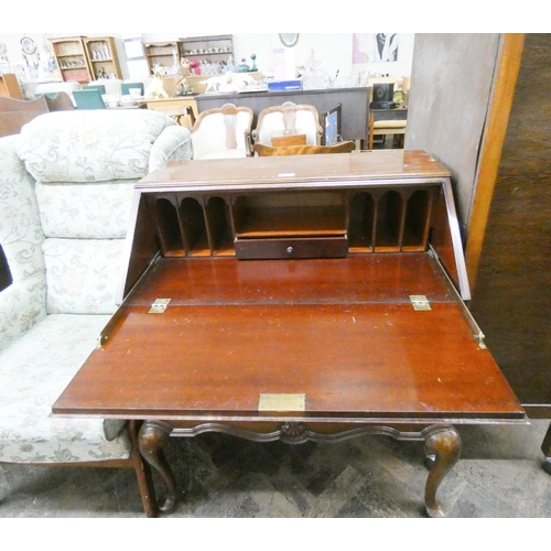 76 - A flame mahogany bureau with two long drawers under standing on cabriole legs, 2'6
