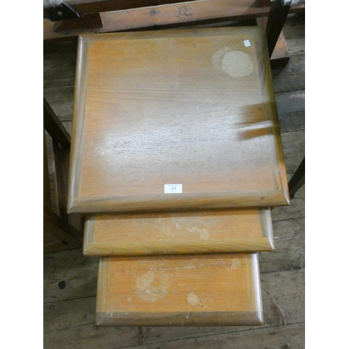 61 - A nest of three Gplan style teak coffee tables (tops marked)