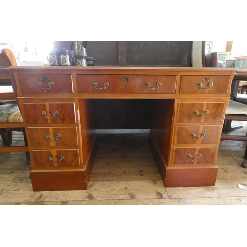 86 - A Georgian style yew wood twin pedestal desk with green leather top