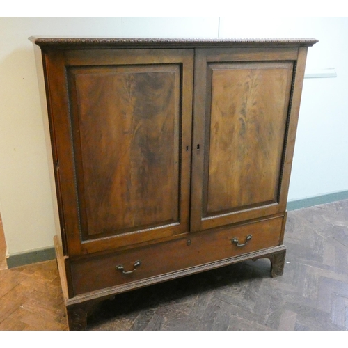 40 - A Georgian flame mahogany linen press style cabinet fitted one drawer to base (has been used as a TV... 