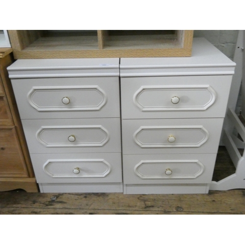 105 - A pair of modern white three drawer bedside chests