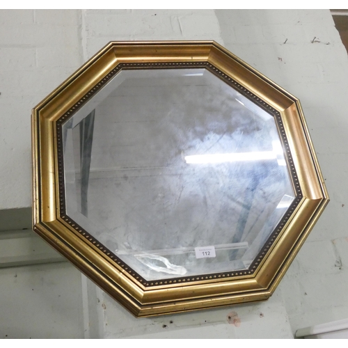 112 - A octagonal bevelled wall mirror in gilt frame