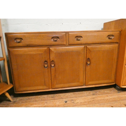 124 - An Ercol Windsor Blonde Elm sideboard fitted two drawers and three cupboards. 4'6