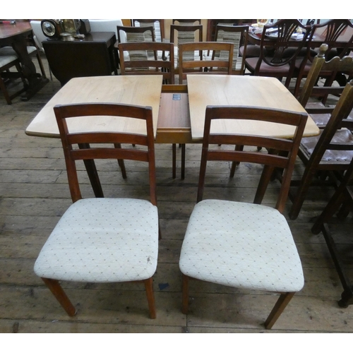 56 - A 1970's/1980's Meredew teak extending dining table with centre leaf with four similar ladder back s...