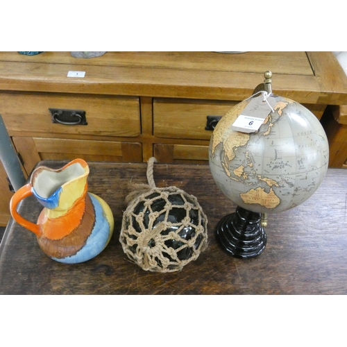 6 - A small globe of the world, deco pottery jug, and a glass float